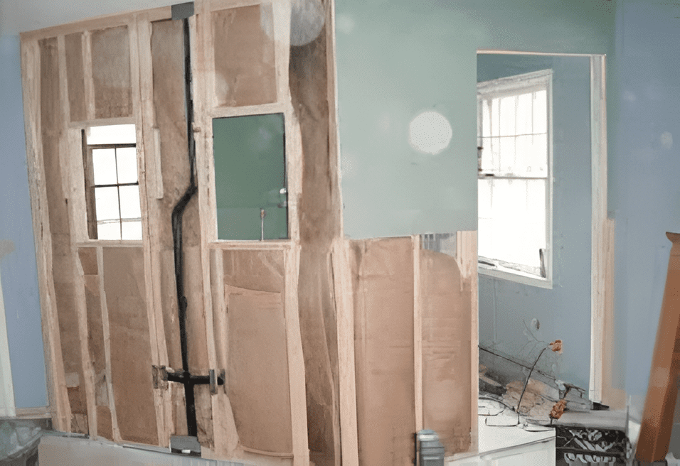 Interior wall framing with insulation, ready for drywall.